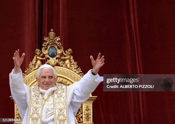 Pope Benedict XVI delivers the traditional "Urbi et Orbi" Easter message from the central loggia of St Peter's Basilica on April 12, 2009 at the...