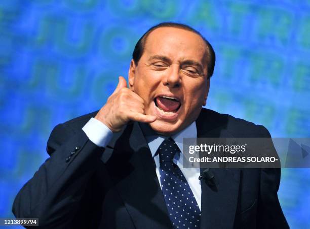 Italian prime minister Silvio Berlusconi gestures as he takes part in the Atreju meeting of young people of PDL , in central Rome, on September 9,...