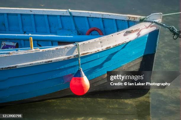 northumberland, england, uk. 20 august 2005. close-up of rowing boat in beadnell harbour - rowboat stock pictures, royalty-free photos & images