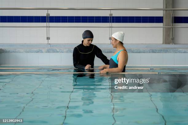 woman doing physiotherapy exercises in the water - hydrotherapy stock pictures, royalty-free photos & images