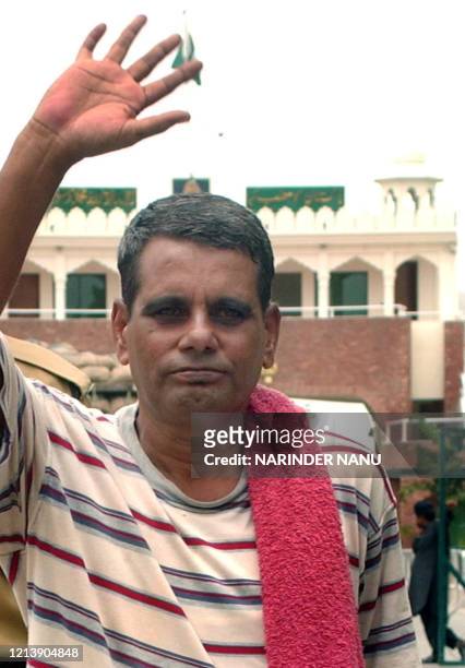 Released Indian prisoner Ram Prakash waves to media representatives as he crosses The India-Pakistan Border at Wagah on July 7, 2008. Prakash, freed...