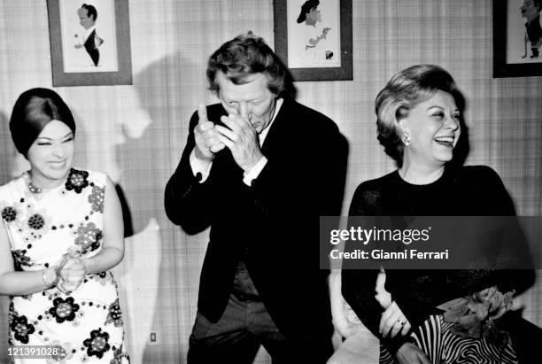 The italian actress Giulietta Masina in an exhibition of paintings with the flamenco dancer Lucero Tena and U.S, actor Danny Kaye Madrid, Spain.