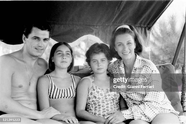 Linda Christian at her villa of 'La Moraleja' with her daughters Romina , Taryn, and Edmund Purdom, 12th August 1964, Madrid, Spain.