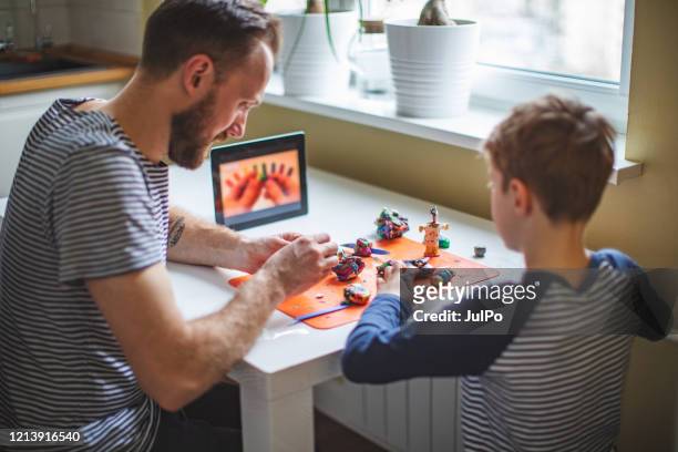 child spending time at home during quarantine - craft stock pictures, royalty-free photos & images