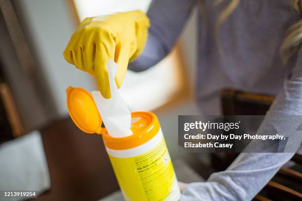 girl pulling out wet wipe - wet wipe stock pictures, royalty-free photos & images