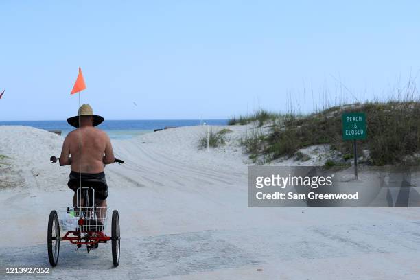 Person looks out toward Jacksonville Beach amid the coronavirus outbreak on March 21, 2020 in Jacksonville, Florida. Jacksonville Mayor Lenny Curry...