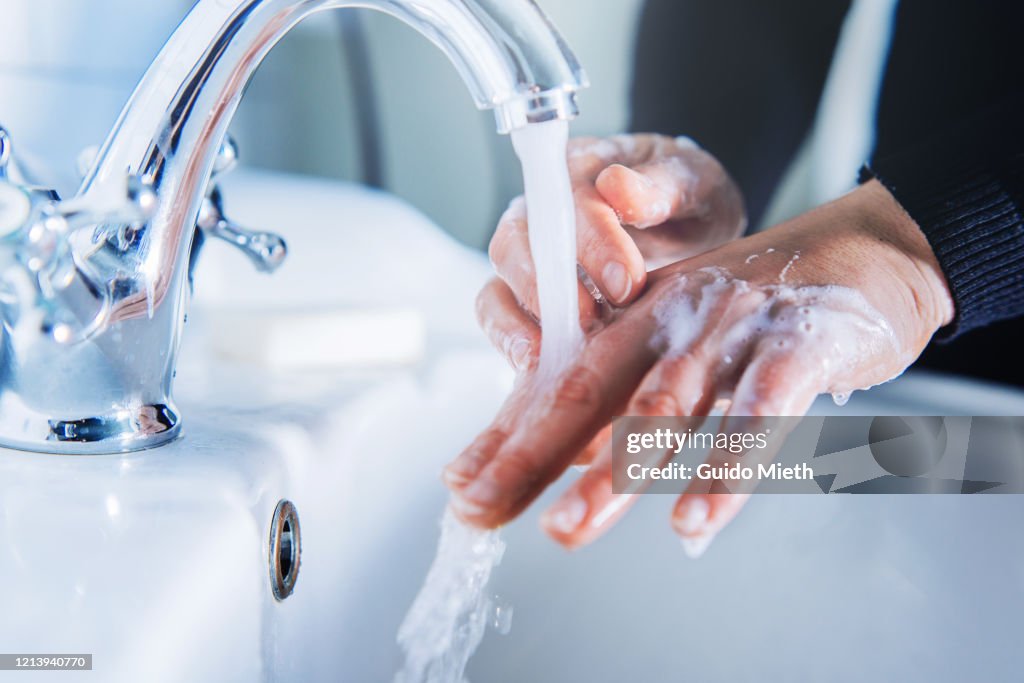 Washing hand at home.