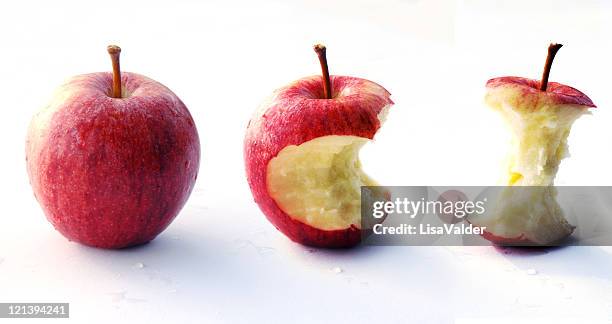 biting red apple - apple with bite stock pictures, royalty-free photos & images