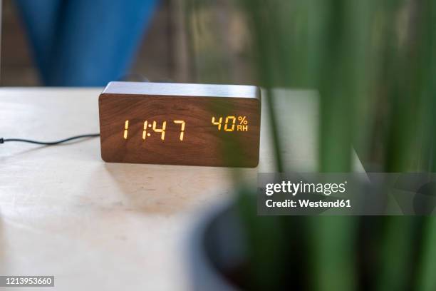 wooden digital clock on desk - digitaluhr stock-fotos und bilder