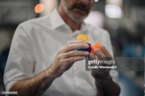 man examining workpiece in a factory - product design stock pictures, royalty-free photos & images