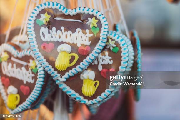 germany, bavaria, munich, heart-shaped gingerbread cookies made for beer fest celebrations - theresienwiese stock pictures, royalty-free photos & images