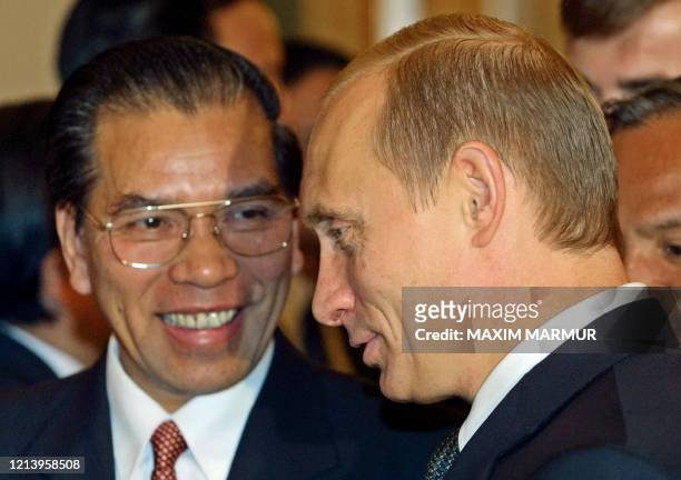 Russian President Vladimir Putin, right, speaks with Vietnamese Communist Party chief Nong Duc Manh during their meeting in the Moscow Kremlin, 10...