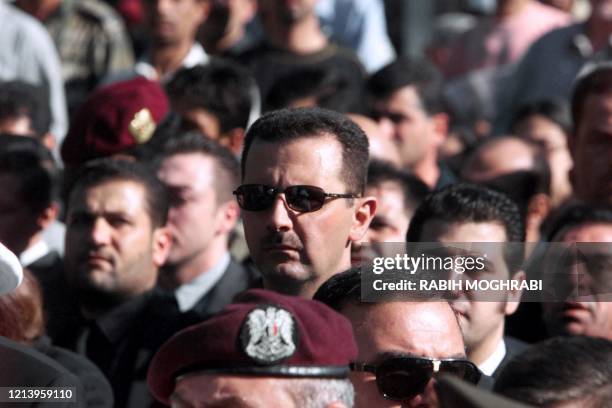 Syrian heir apparent Bashar al-Assad marches behind the coffin of his father, Syrian President Hafez al-Assad, during his funeral in Damascus 13 June...