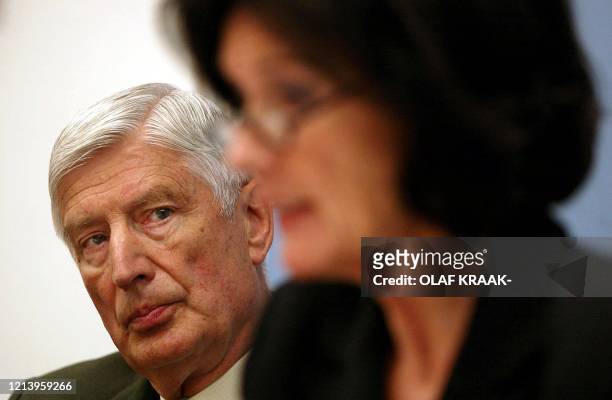 Former Dutch Christian Democrat prime minister Dries van Agt listens to Gretta Duisenberg, wife of the President of the European Central Bank Wim...