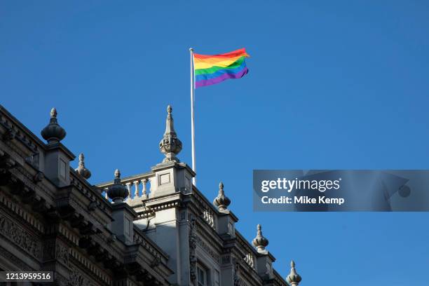 Rainbow flag flying on the rooftop of the Cabinet Office on Whitehall on 26th February 2020 in London, United Kingdom. The rainbow flag, commonly the...