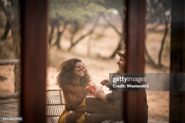 happy couple drinking fresh ice tea drinks together - ice tea stock pictures, royalty-free photos & images