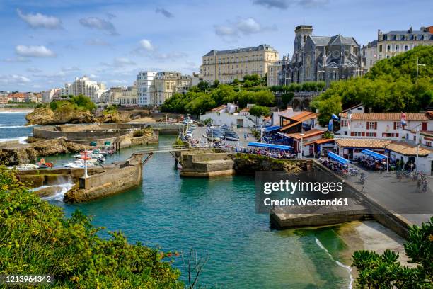 france, pyrenees-atlantiques, biarritz, le port des pecheurs marina with church of saint eugenie in background - biarritz fotografías e imágenes de stock