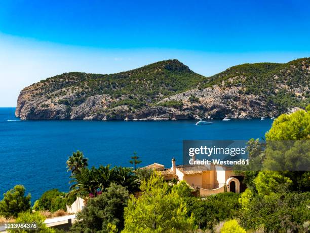 spain, balearic islands, camp de mar, clear sky over forested bay in summer - majorca ストックフォトと画像