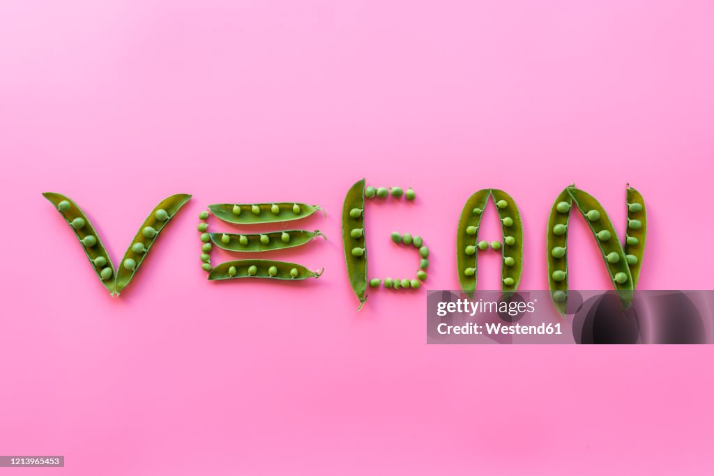 Studio shot of green peas arranged into word