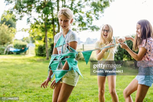 happy girls having fun on a birthday party outdoors - birthday girl stock pictures, royalty-free photos & images