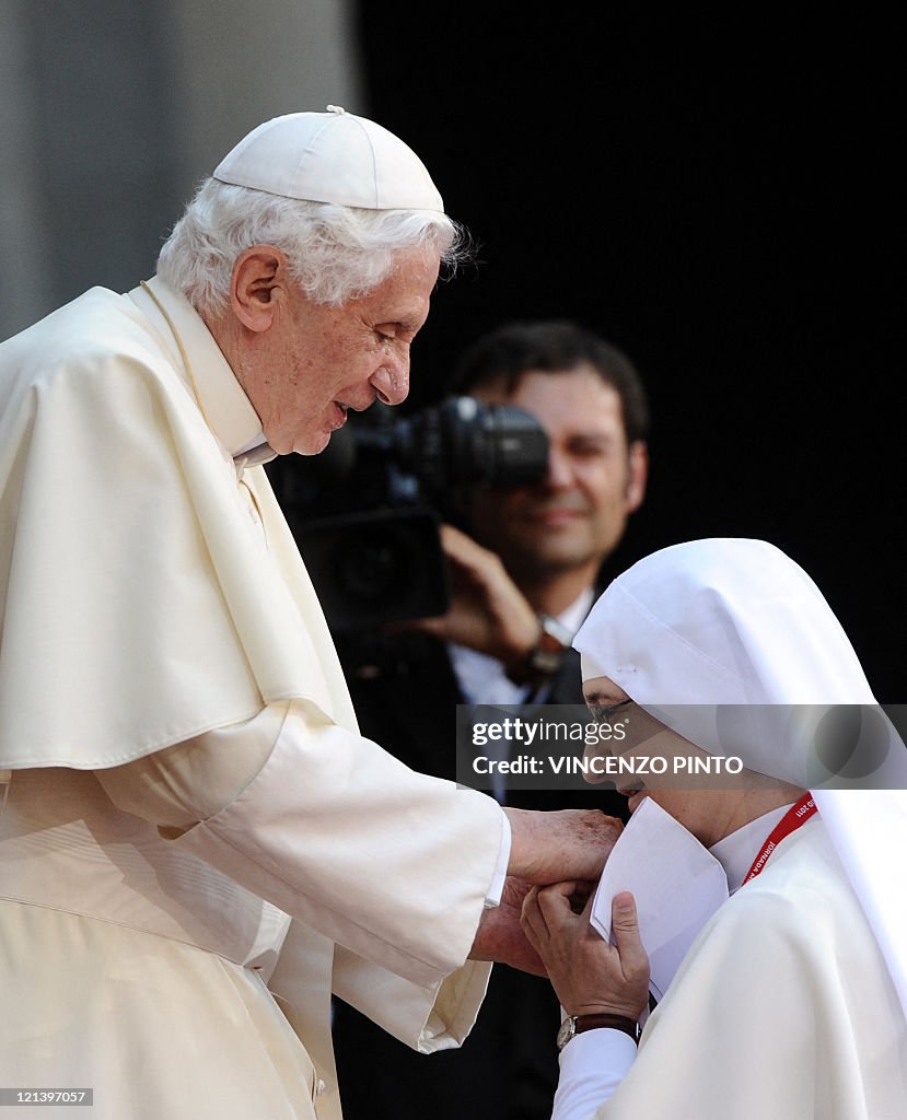 Pope Hand A nun kisses the hand of Pope Benedict XVI at the Monastery of El ...
