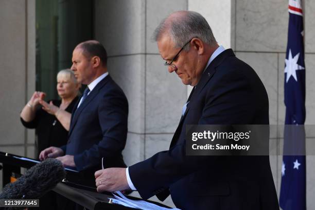 Prime Minister Scott Morrison and Treasurer Josh Frydenberg speak during a press conference at Parliament House on March 22, 2020 in Canberra,...