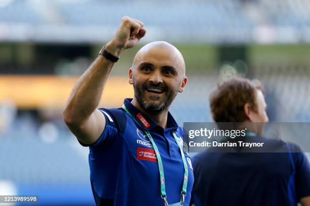 Rhyce Shaw, Senior Coach of the Kangaroos celebrates his team win after the round 1 AFL match between the North Melbourne Kangaroos and the St Kilda...