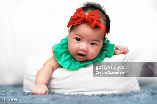 cute little around two months old baby boy, playing at home on the carpet in bedroom, soft white backgrounds behind her. - seborrheic dermatitis stock pictures, royalty-free photos & images