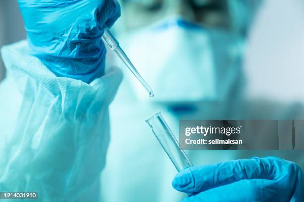 scientist woman working in the cdc laboratory for covid-19 - pipette stock pictures, royalty-free photos & images