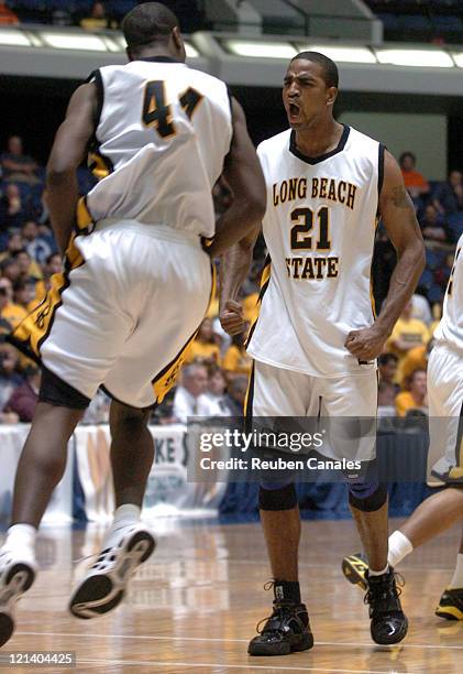 Forwards Dominique Ricks and Mark Dawson of the Long Beach State 49ers celebrate a 77 to 63 win over the University of California - Irvine Anteaters...