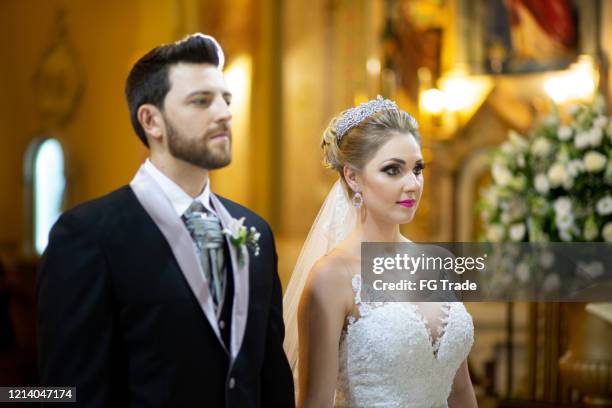 bride and groom on altar at church - wedding day - church chapel stock pictures, royalty-free photos & images