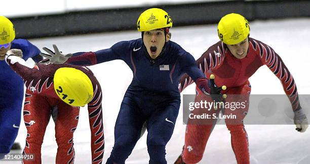 Apolo Anton Ohno of the United States celebrates winning a gold medal during the Short Track Speed Skating 500 m at the 2006 Olympic Games held at...