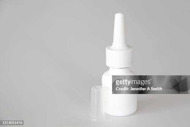 nasal spray - spray bottle stock-fotos und bilder