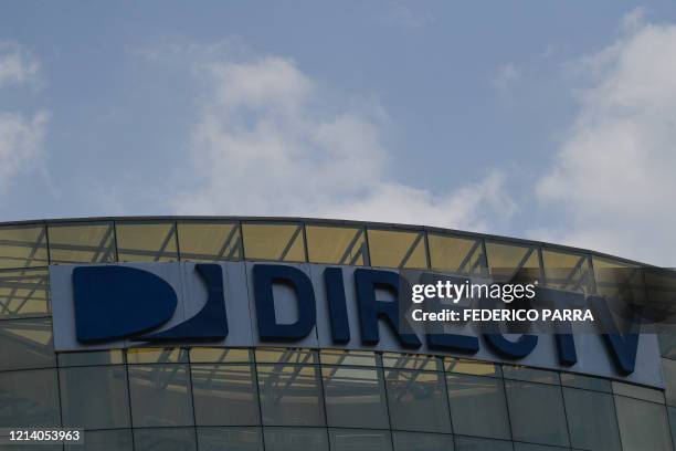 View of DirecTV broadcast satellite service provider logo at its headquarters in Caracas on May 19, 2020. US telecommunications giant AT&T announced...