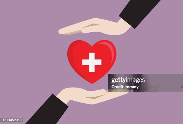 two hands with a blood donation symbol - red cross stock illustrations