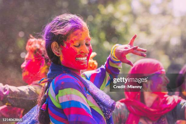 holi festival dancing smiling young indian woman jaipur india - holi festival and indian person stock pictures, royalty-free photos & images