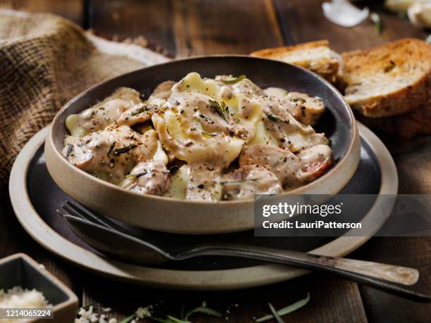cheese ravioli with sausage and mushrooms in a rosemary cream sauce - pork sausage stock pictures, royalty-free photos & images