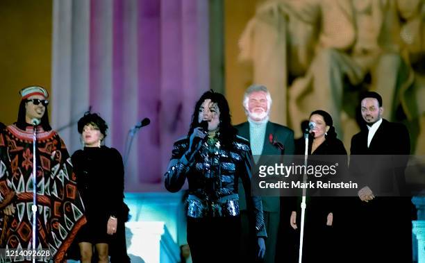 Michael Jackson, Kenny Rogers, Diana Ross and Stevie Wonder wait on stage at the Lincoln Memorial Inaugural gala for President William Clinton and...