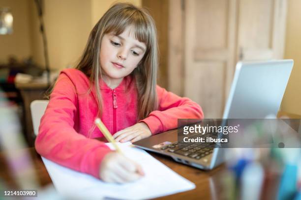 8 years old child girl studying from home - 8 9 years stock pictures, royalty-free photos & images