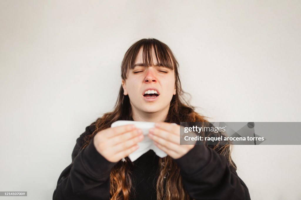 Close uo view of young woman suffering spring allergy