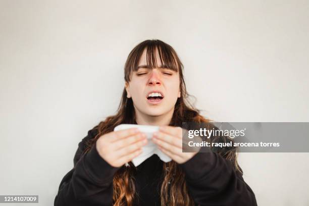 close uo view of young woman suffering spring allergy - snyta sig bildbanksfoton och bilder