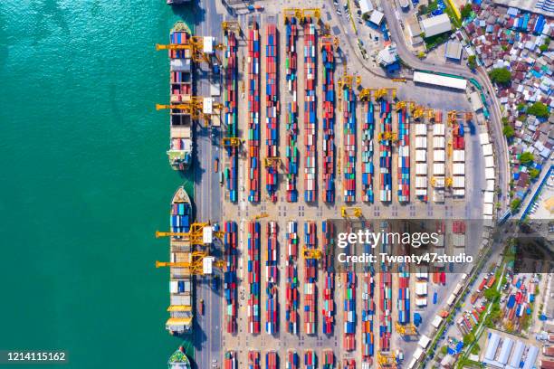 aerial view of logistic port with container ship for import and export shipping in southeast asia - shipyard aerial stock pictures, royalty-free photos & images