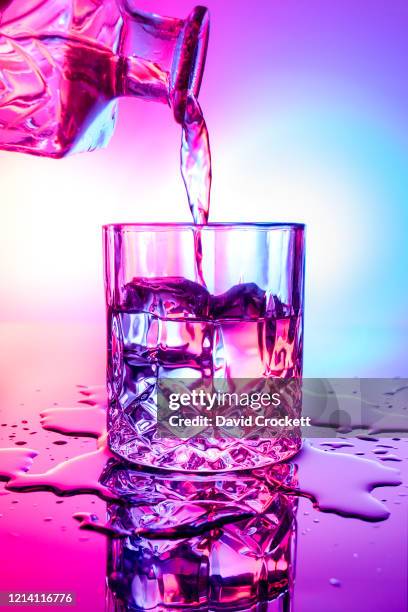 clear cocktail pour - cocktails water stock pictures, royalty-free photos & images