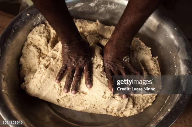 hands preparing dough. - black chef stock pictures, royalty-free photos & images