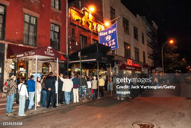 View of a fans as they wait in line outside the Blue Note Jazz club in Greenwich Village, New York, New York, June 5, 2006. They were there for a...