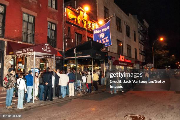 View of a fans as they wait in line outside the Blue Note Jazz club in Greenwich Village, New York, New York, June 5, 2006. They were there for a...