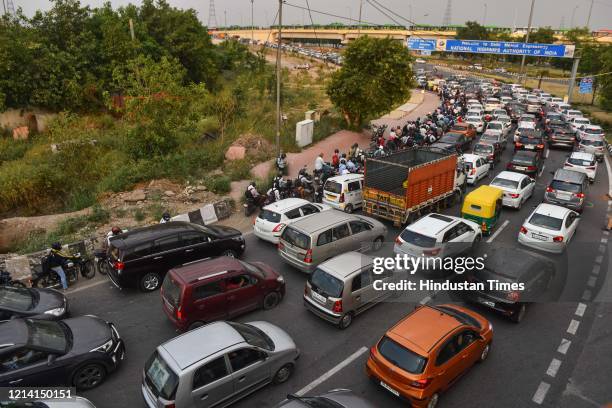 Massive traffic jam seen on National Highway after government eased many lockdown restrictions, at Delhi-Meerut Expressway, on May 19, 2020 in New...