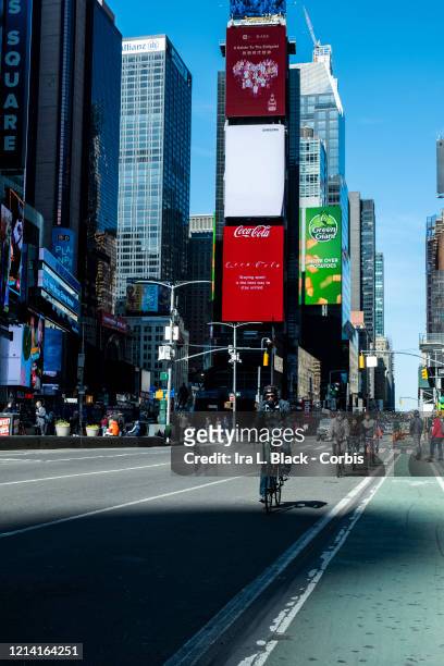 The Times Square area on a Sunday afternoon bicycle riders. The streets were mostly empty on the same day that New York State Governor Andrew Cuomo...