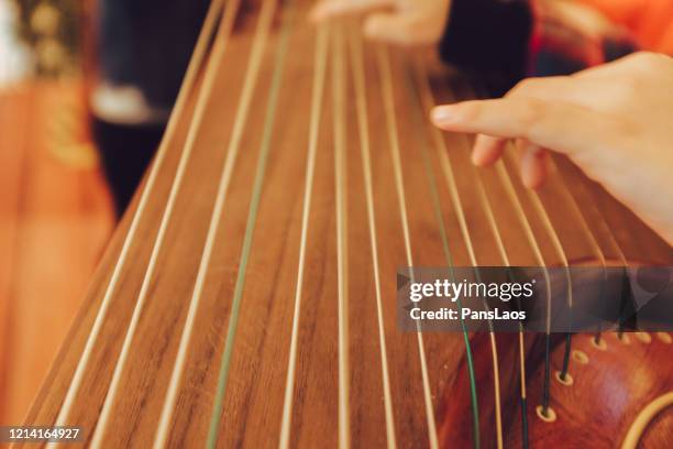 playing chinese traditional musical guzheng - zither stock pictures, royalty-free photos & images