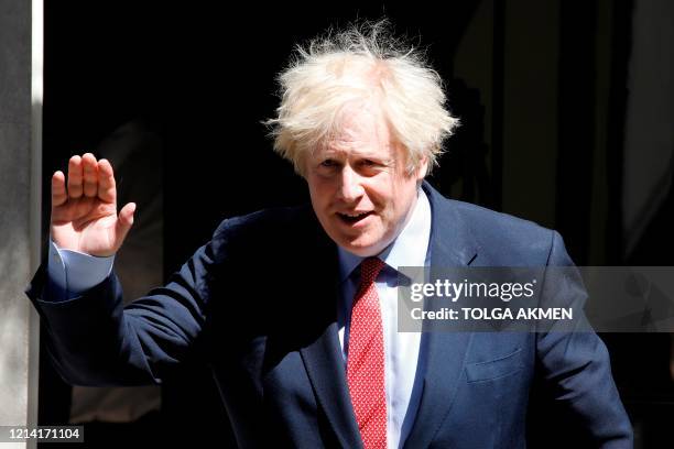 Britain's Prime Minister Boris Johnson leaves 10 Downing Street in central London on May 20, 2020 to attend Prime Minister's Questions in the Houses...